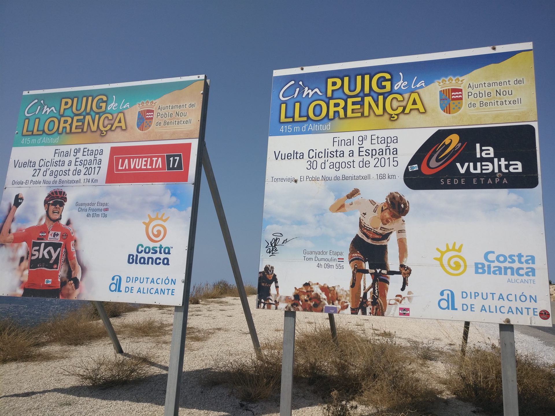 The two Vuelta signs at the top of the Puig Llorenca: Chris Froome (2017) on the left, Tom Dumoulin (2015) on the right